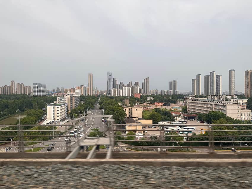 Qingshan District cityscape viewed from a train