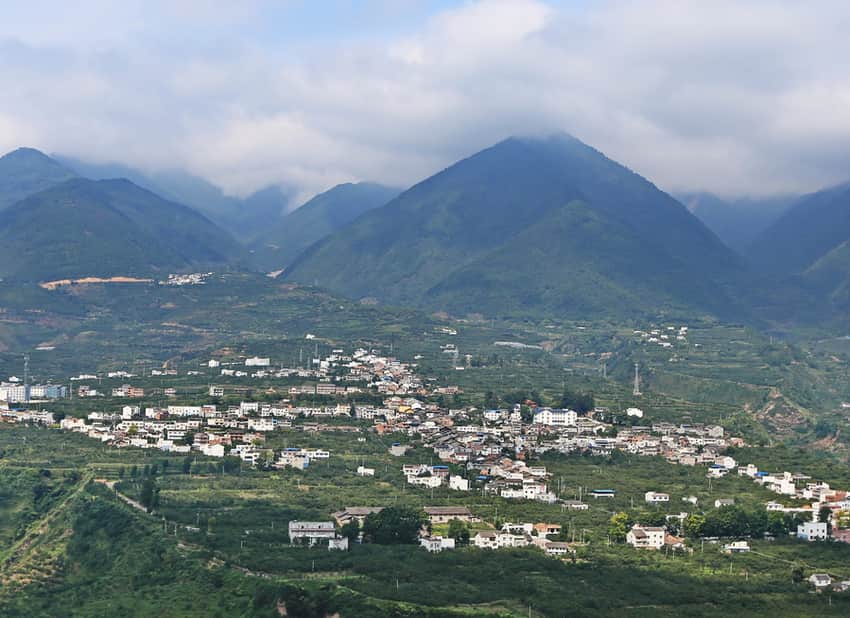High view of Qingxi town among cultivated mountain slopes in Hanyuan
