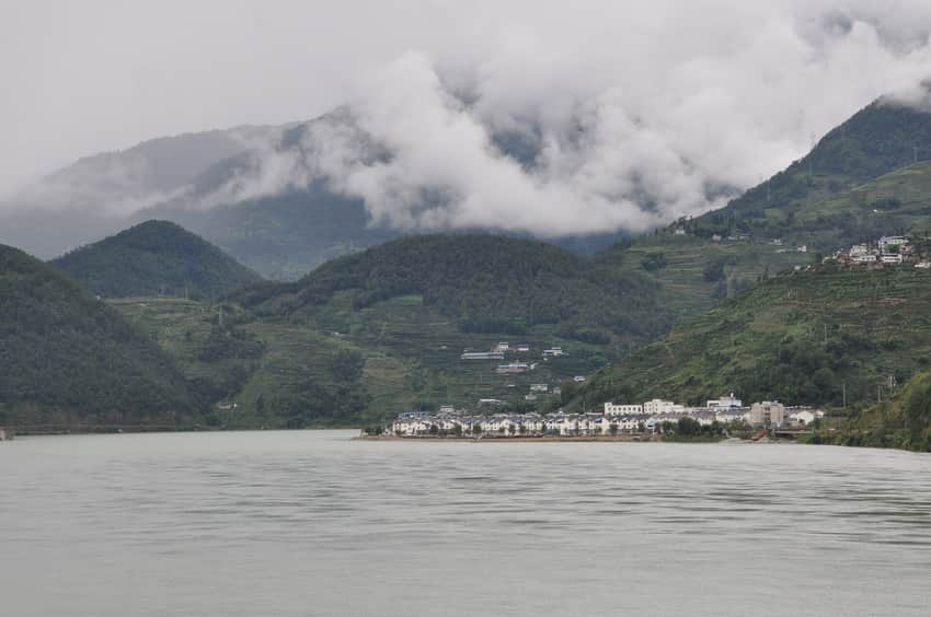Reservoir, clouded cultivated hills, and waterside settlement in Hanyuan