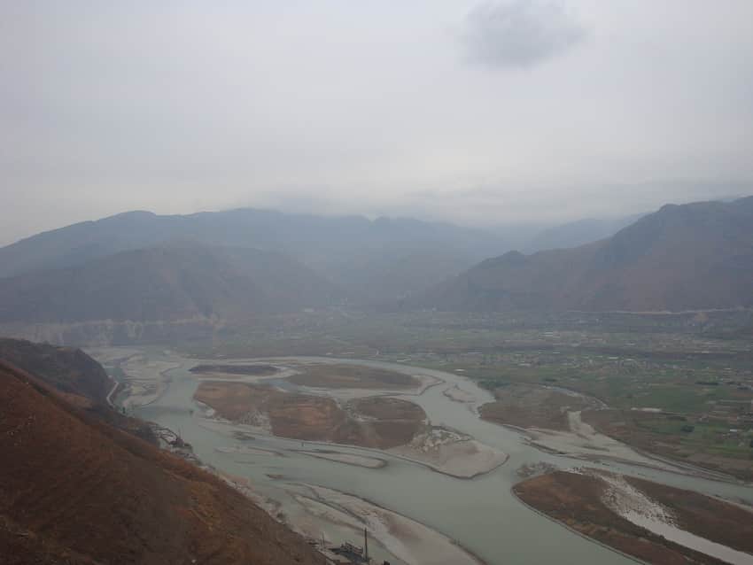 High view over braided water, fields, and settlement in Hanyuan