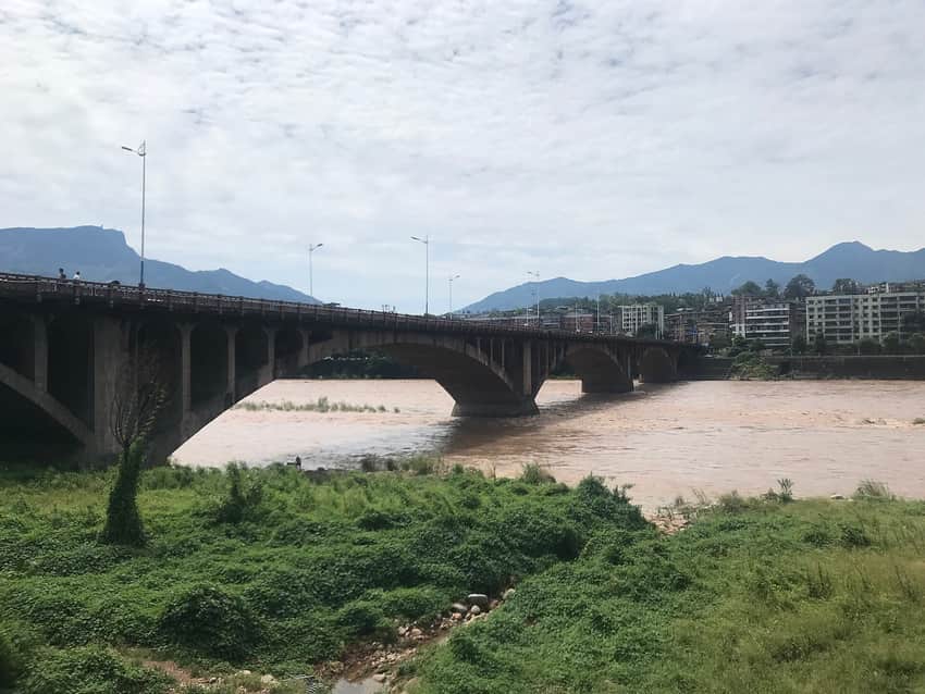 Concrete Westgate Bridge above a high-flow Qingyi River