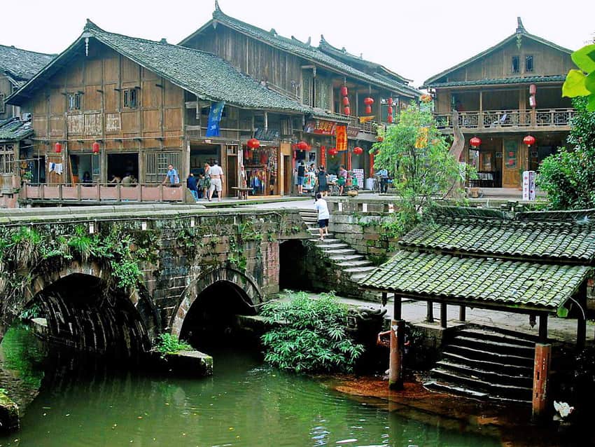 Buildings, bridge, and water edge in Shangli old town