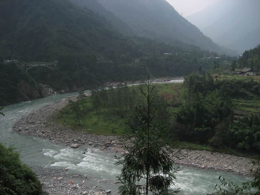 Tight Qingyi River bend between wooded slopes in Tianquan