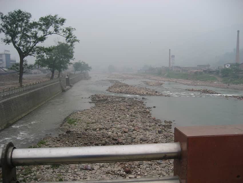 Shallow gravel river and industrial edge in Yingjing