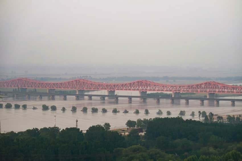 Multiple railway bridges and historic piers across the Yellow River