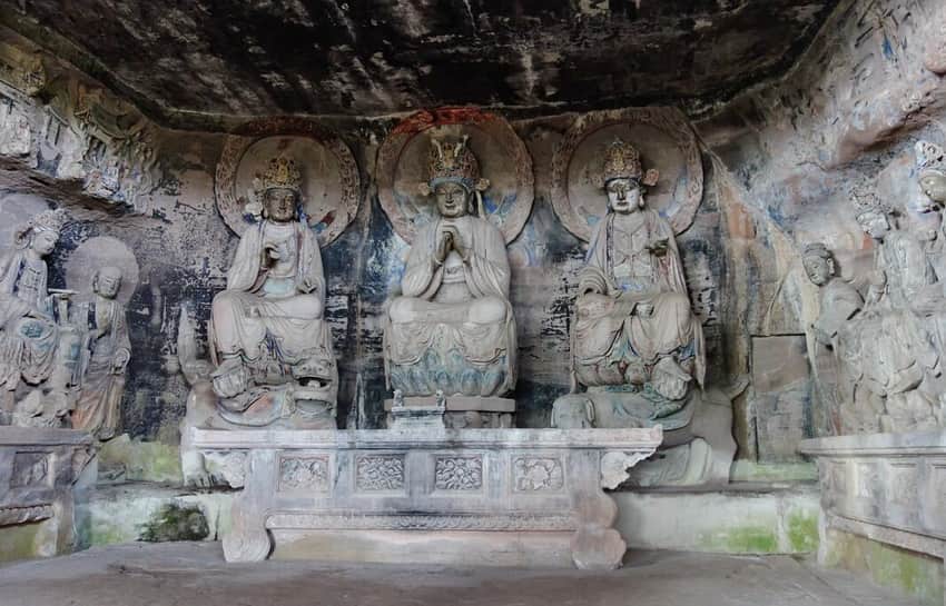 Dense carved figure group inside Huayan Cave