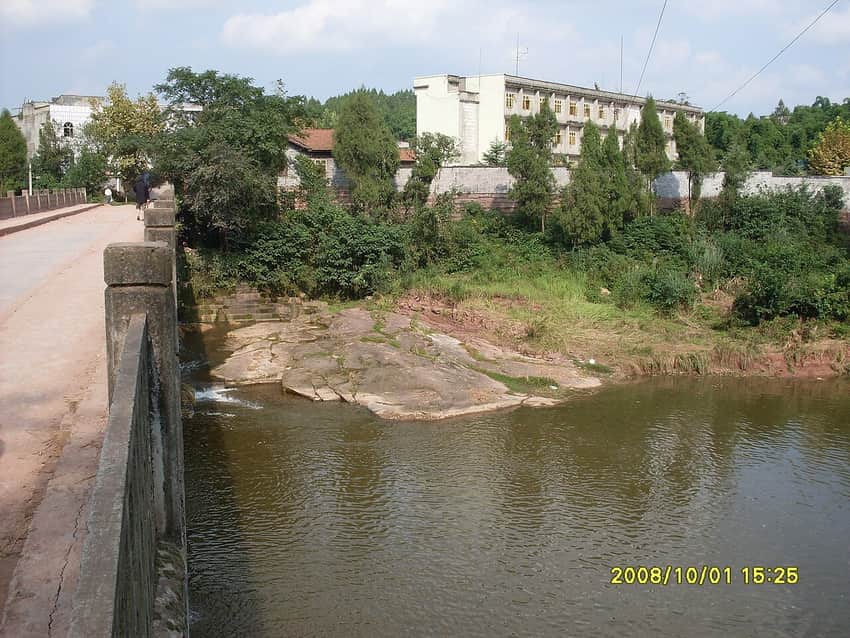 Dated bridge and surrounding county landscape in Lezhi