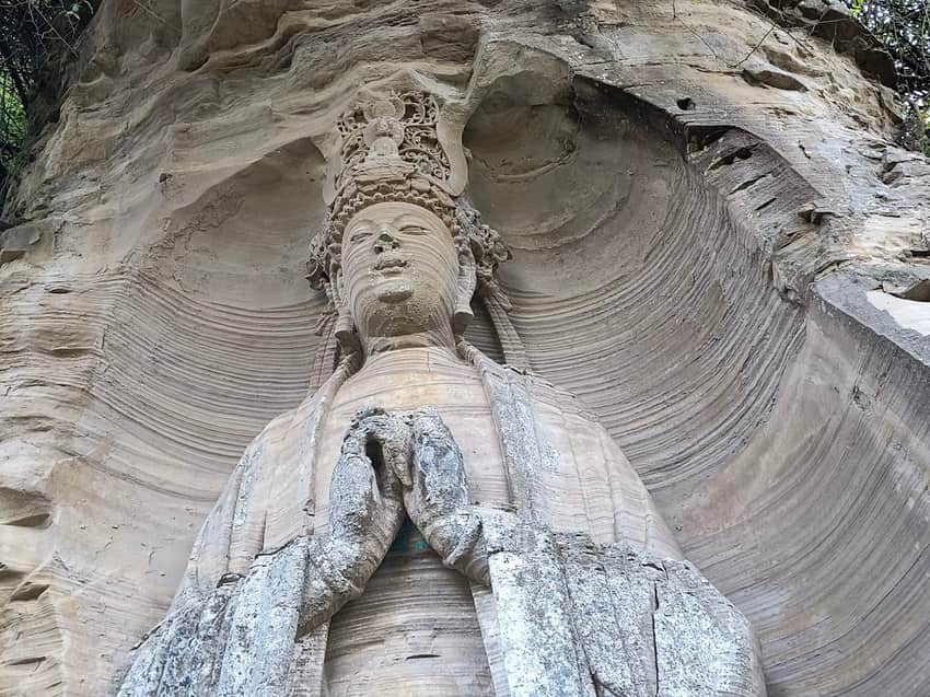 Low-angle view of the standing Vairocana figure at Mingshan Temple